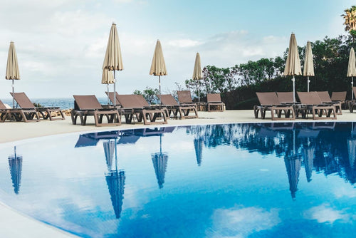 Commercial swimming pool with clear blue water.